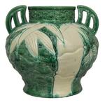 Carved Japanese Awaji Pottery Vase with Carved Design and Wing Handles
** Circa 1920s
** Lively form with splayed foot and fat body. Bamboo motif deeply carved into the slathered surface. Embossed collar and pointy wing handles.
** H: 10, Dia: 12
** $9,500